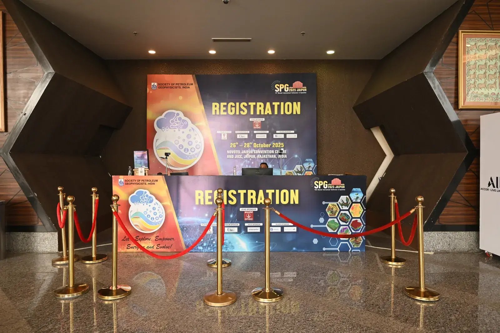 SPG 2025 Jaipur registration desk with Society of Petroleum Geophysicists branding and queue barriers