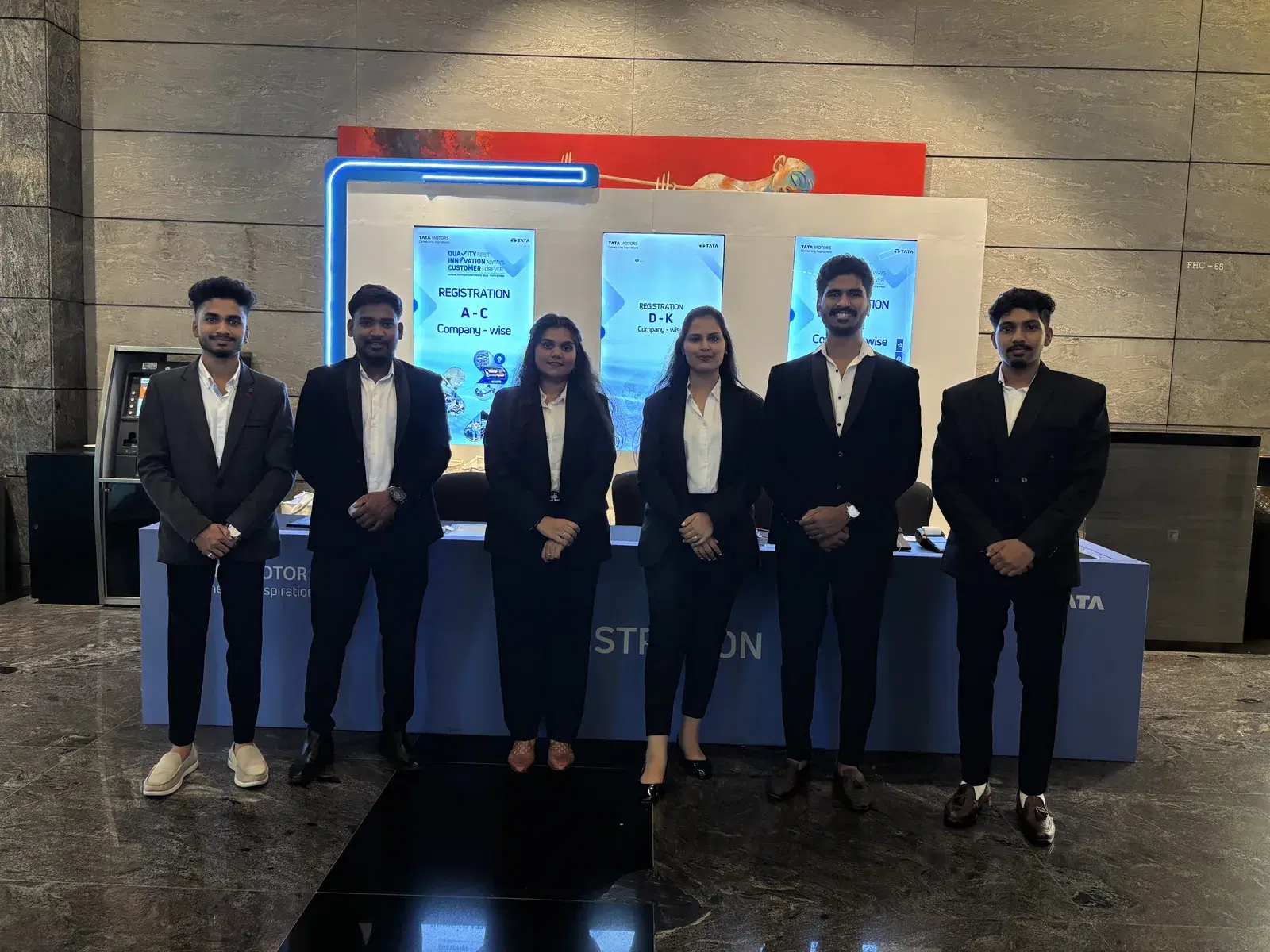 TATA Motors 2025 registration desk with alphabetical company-wise counter signage