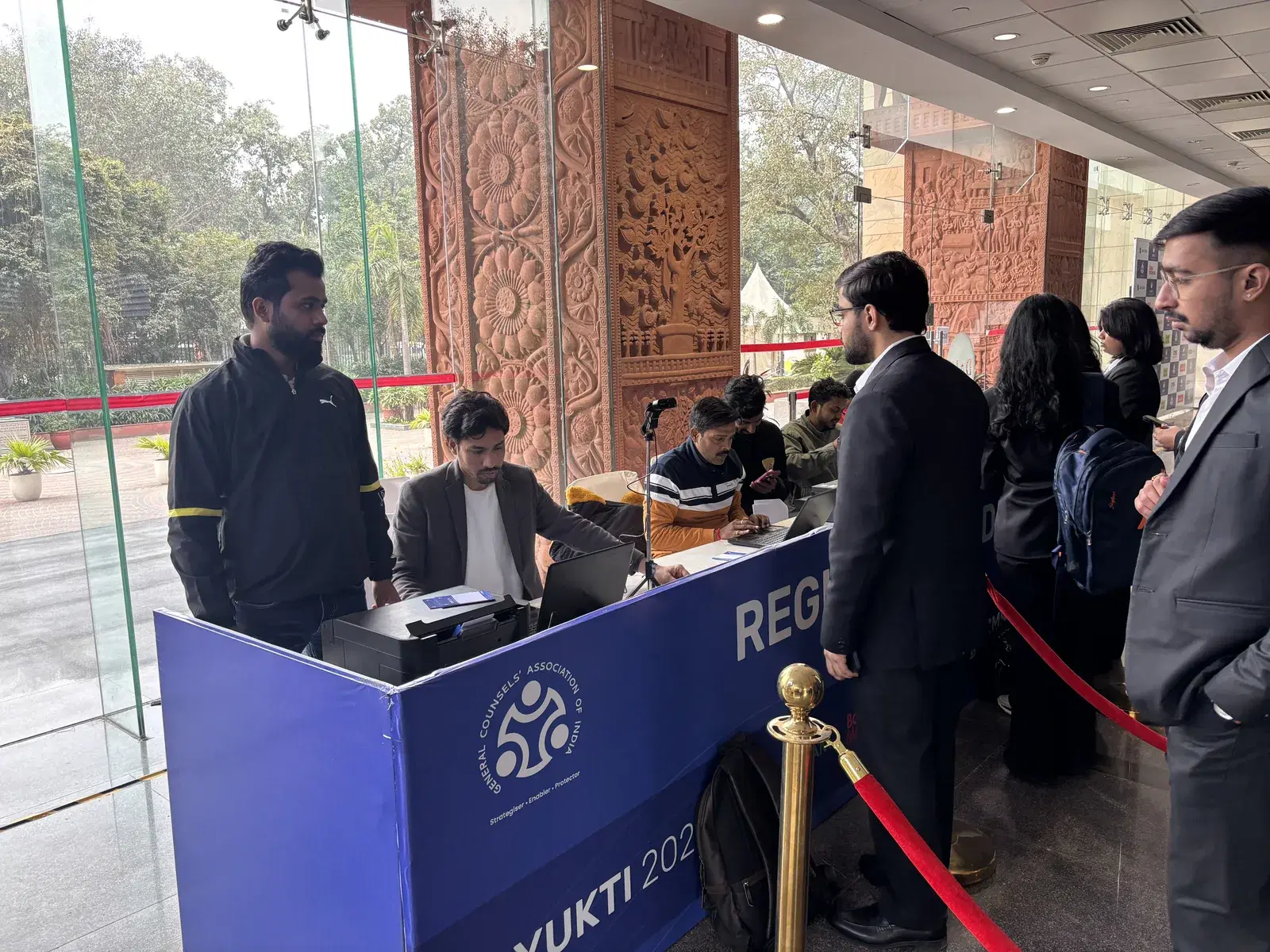 Delegates checking in at the YUKTI 2026 registration desk with on-site badge printing