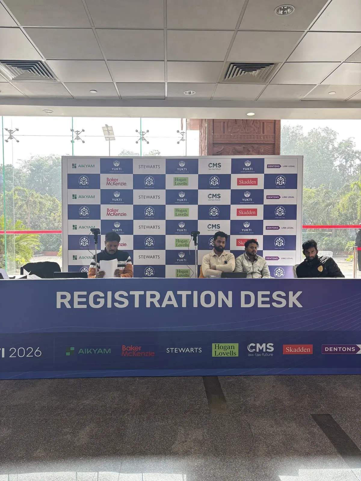 YUKTI 2026 registration counter with sponsor backdrop